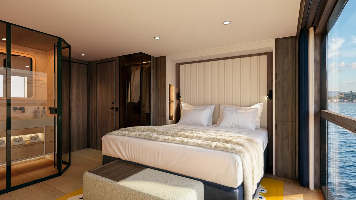 Transcend Connect stateroom bedroom with king bed and smart-glass bathroom partition