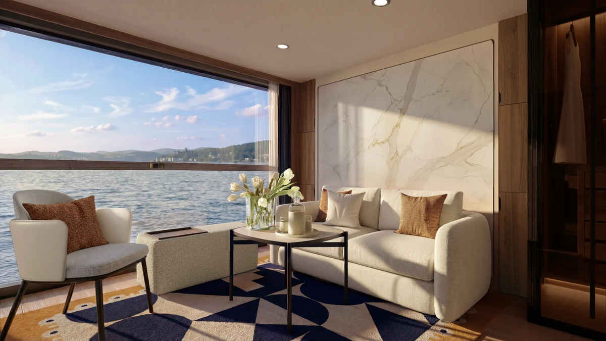 Transcend Connect Two-Room Suite living room with sofa, marble feature wall, and panoramic river view